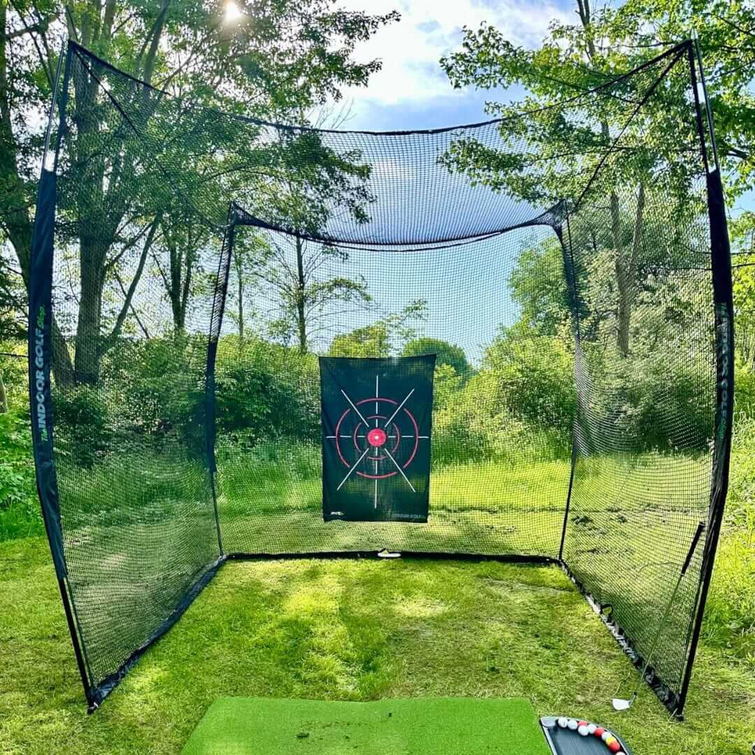 10' x 10' x 10' Square Golf Net set up outdoors with target for practice, ideal for improving golf skills.