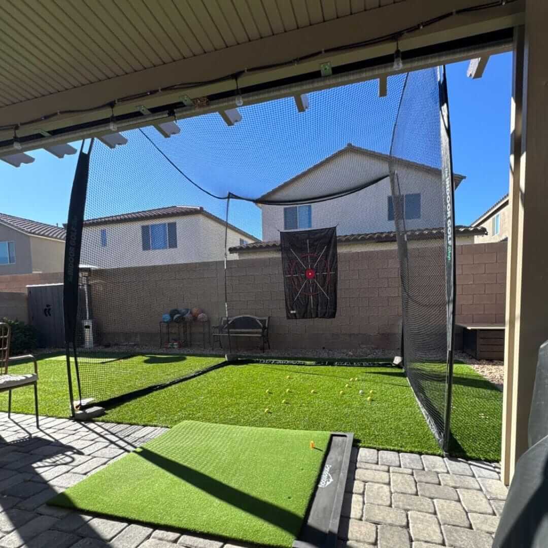 10' x 10' x 10' Square Golf Net set up in a backyard, providing a practice area for golf enthusiasts.