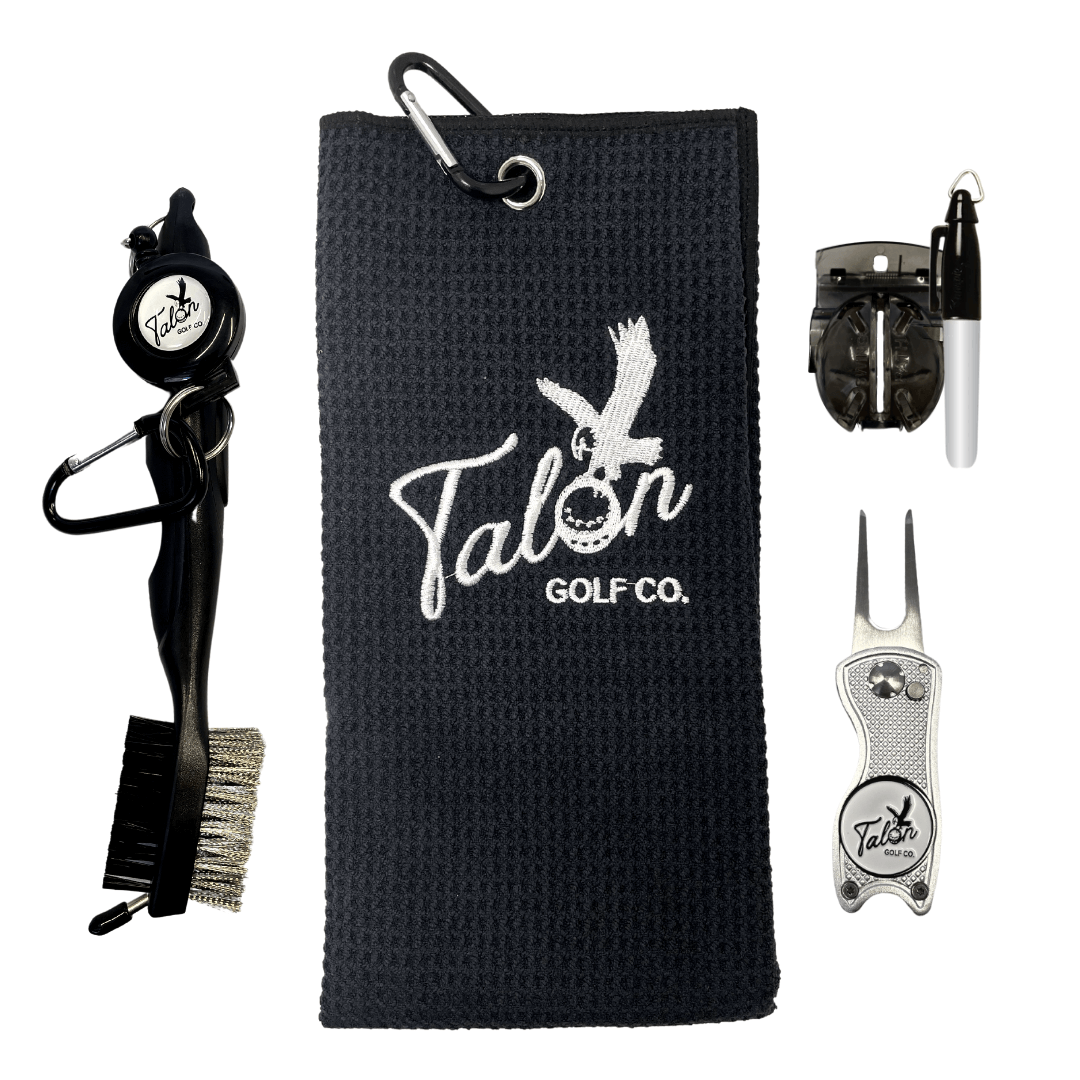 Golf Bag Accessory Pack featuring a black golf towel, retractable brush, silver divot tool, and additional cleaning accessories.