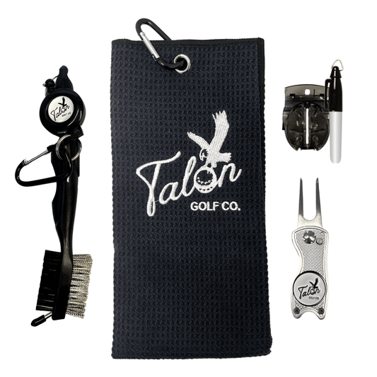 Golf Bag Accessory Pack featuring a black golf towel, retractable brush, silver divot tool, and additional cleaning accessories.