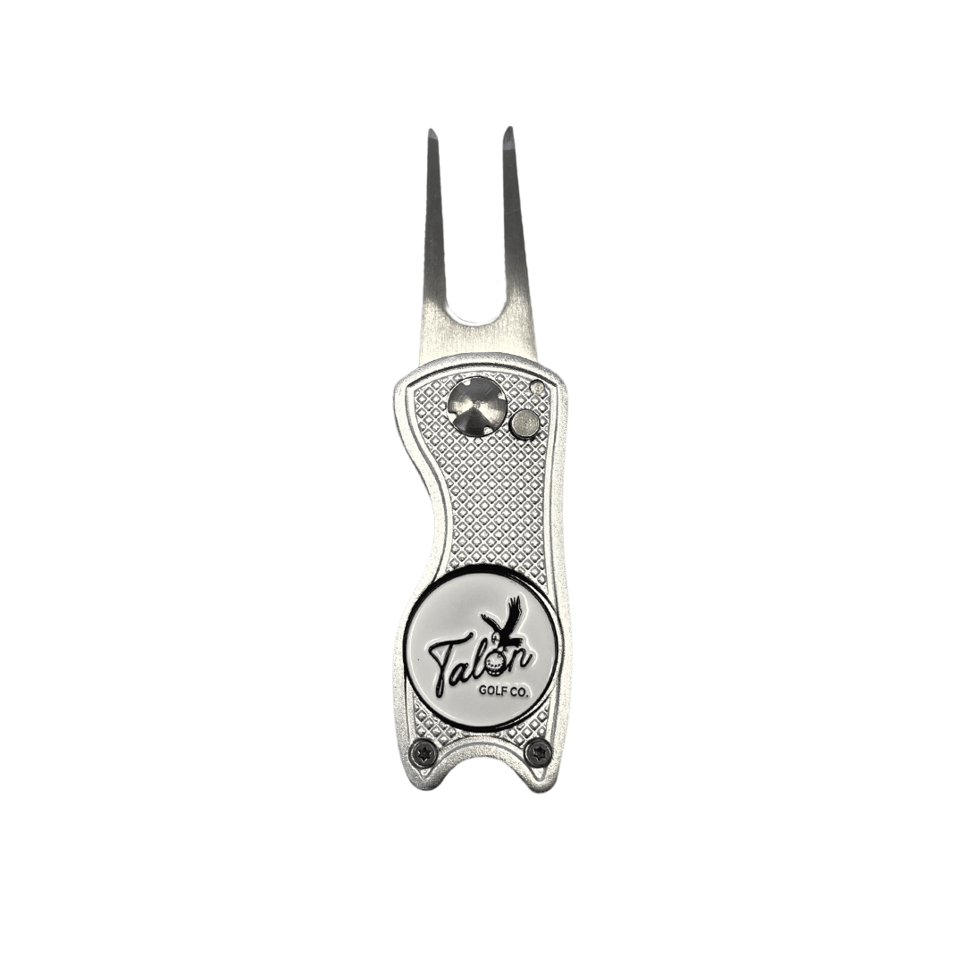 Silver golf divot tool from the Golf Bag Accessory Pack with logo and built-in magnetic ball marker.