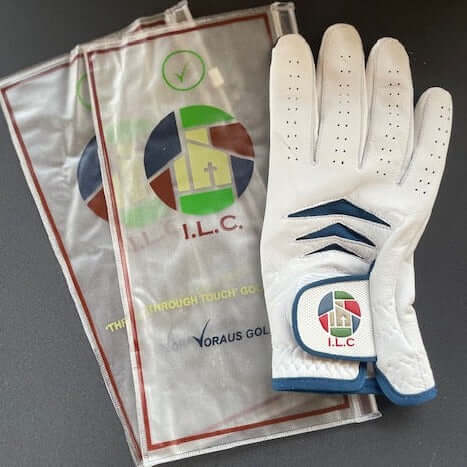 Custom Through Touch Glove displayed with packaging on a dark surface.