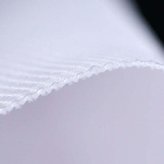 Close-up of SIG Preferred Finished Golf Impact Screen fabric with finished edges, showcasing its smooth texture.