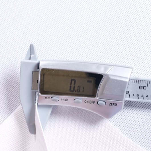 Measurement of material thickness using a digital caliper showing 0.81 mm for SIG Preferred Finished Golf Impact Screen.