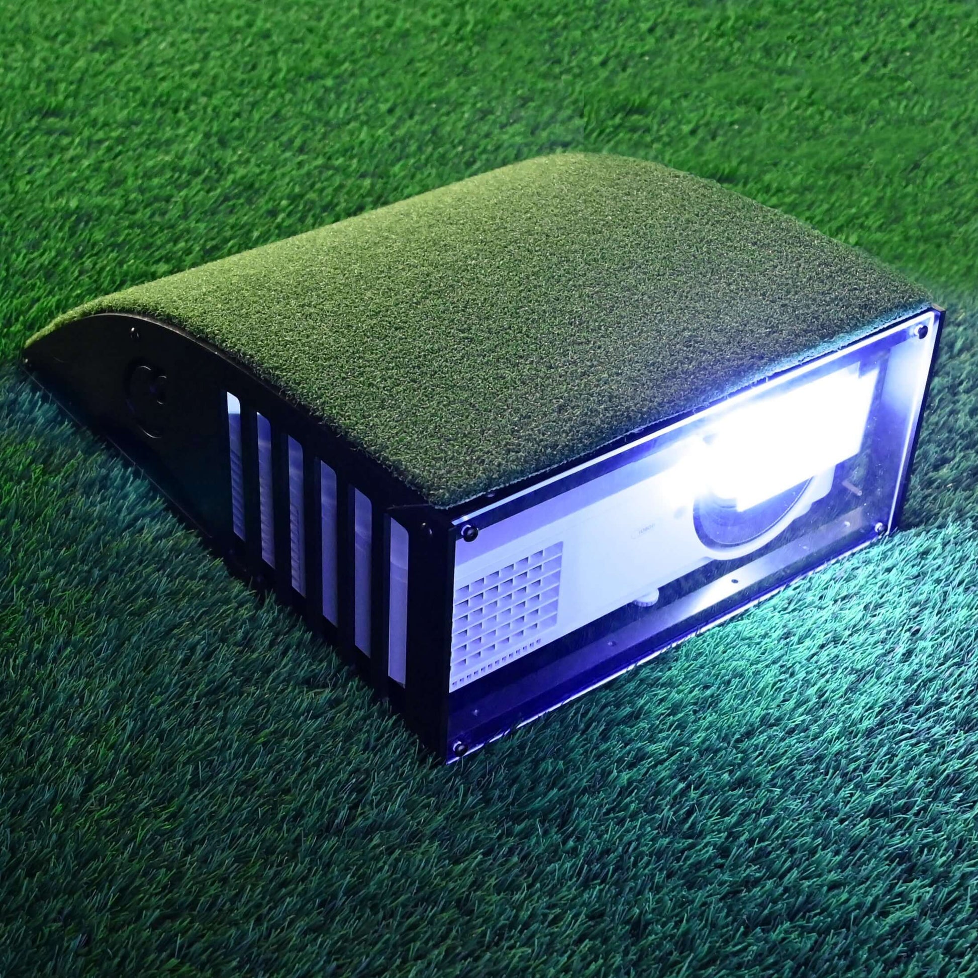 Carl's Floor Mounted Projector Enclosure on grass, showcasing durability and protection for projectors.