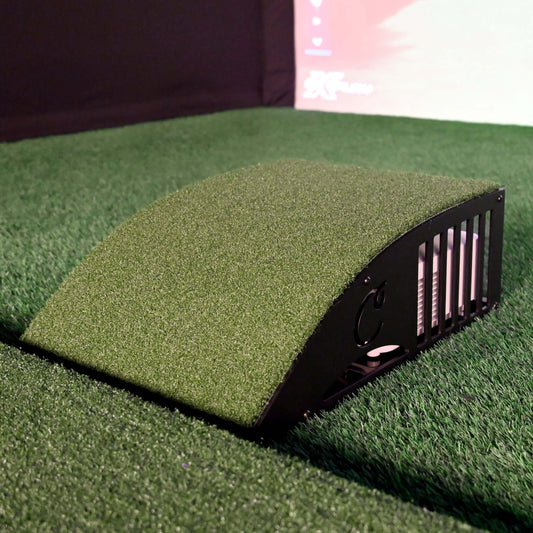Carl's Floor Mounted Projector Enclosure on synthetic grass for golf simulator setup.