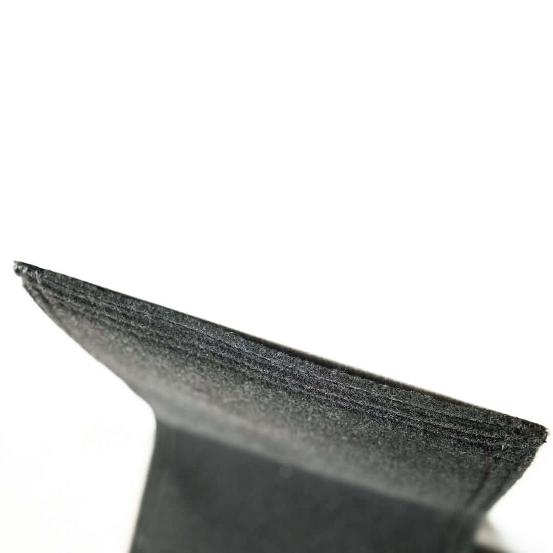 Close-up of the Carpet Panel Gap Pad Golf Simulator Accessory showing its textured edge and quality material.