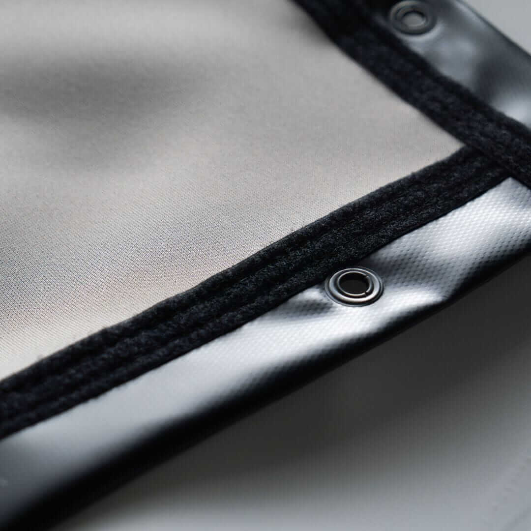 Close-up of the SIGPRO Premier Golf Simulator Impact Screen edge and grommet detail, showcasing premium material and finishing.