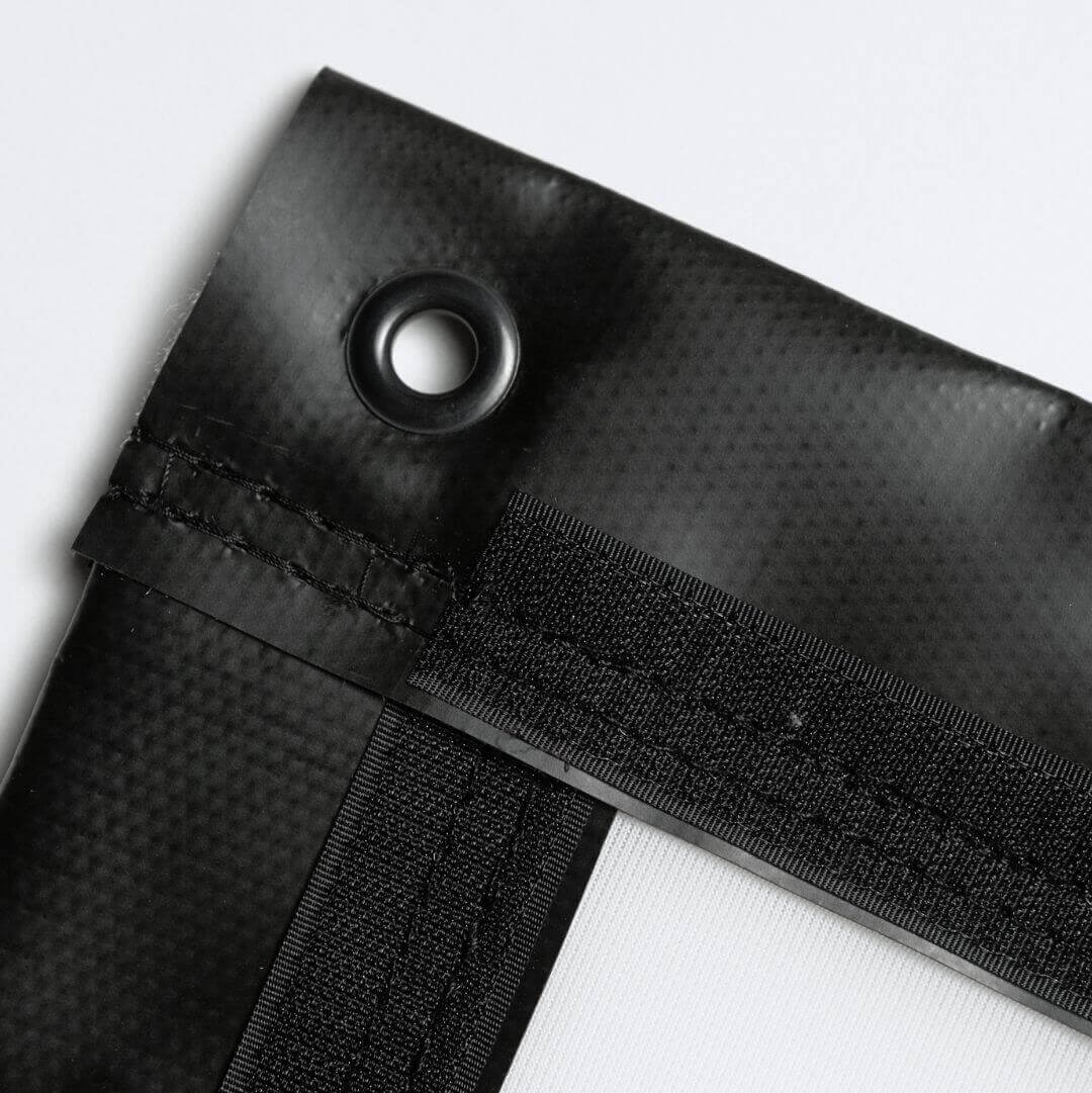 Close-up of Golf Simulator Impact Screen - SIGPRO Premium showing finished edges and grommet detail.