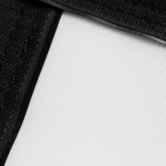 Close-up of the fabric texture showing black and white details of the Golf Simulator Impact Screen - SIGPRO Premium.