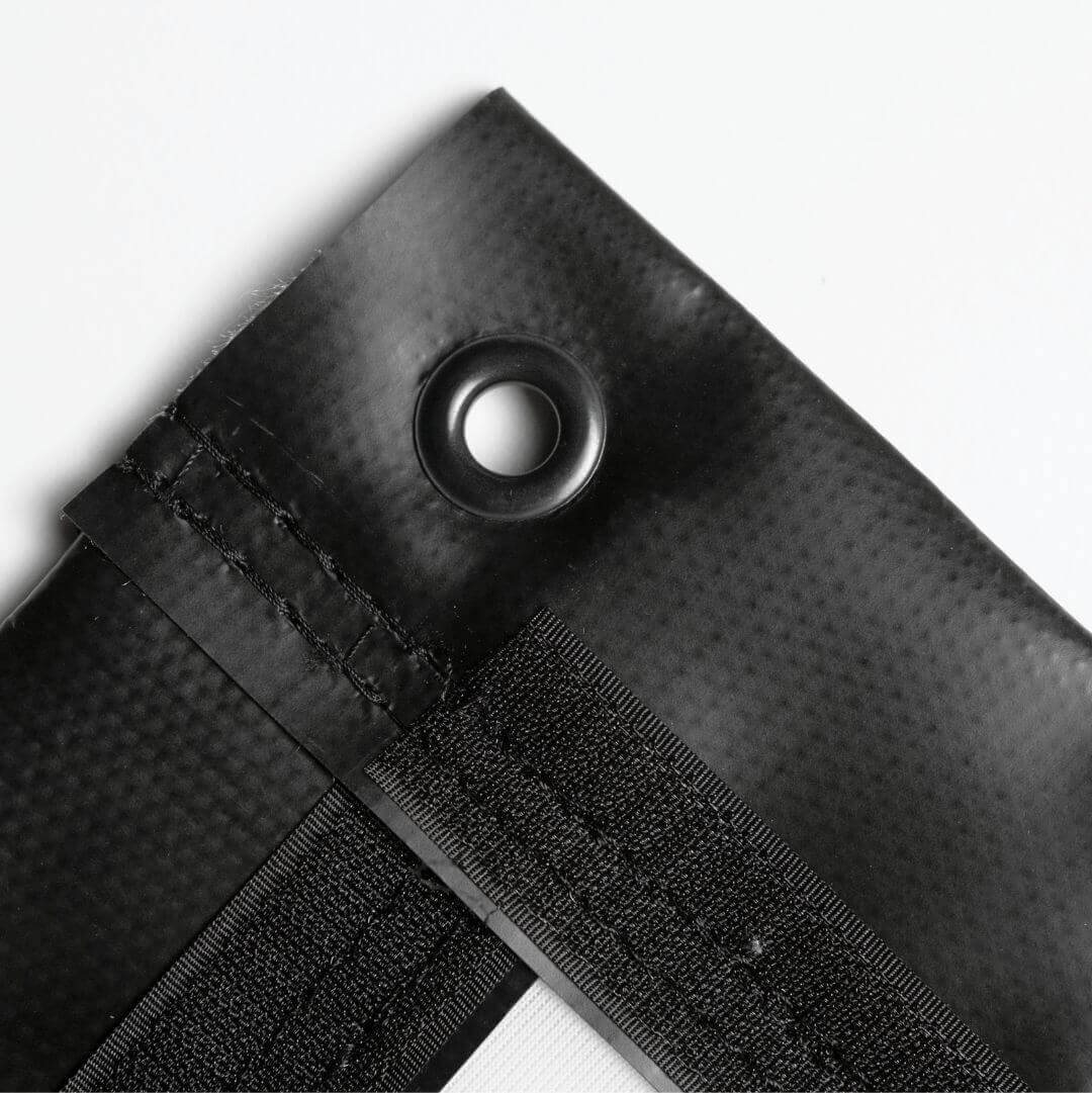 Close-up of the Golf Simulator Impact Screen - SIGPRO Premium showing finished edges and grommet details.